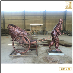 步行街拉车人物铜雕塑铸造